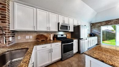 Kitchen featuring stainless steel appliances, vau