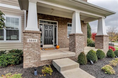 Covered porch welcomes friends to 5848 Gaston Drive. 