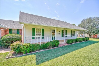What A Welcome! LONG front porch sets an inviting 