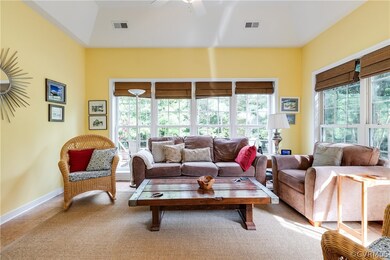 SUN PORCH: boasts ceramic tile floors, vaulted cei