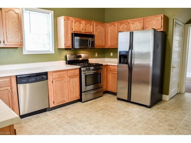 Kitchen has stainless steel appliances.