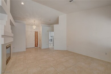 Formal entry, living room features high ceilings