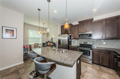 Kitchen with breakfast bar and eat in area
