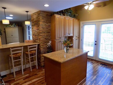 Alternate view of kitchen featuring a stone accent