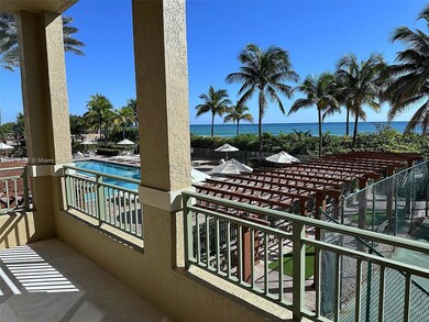 long balcony view of pool and ocean