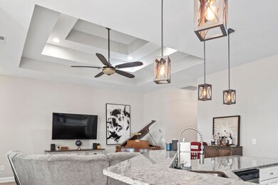 Kitchen with decorative light fixtures, sink, and 