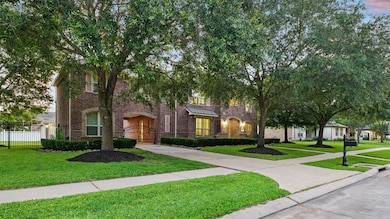 Nestled on an oversized lot with expansive side ya