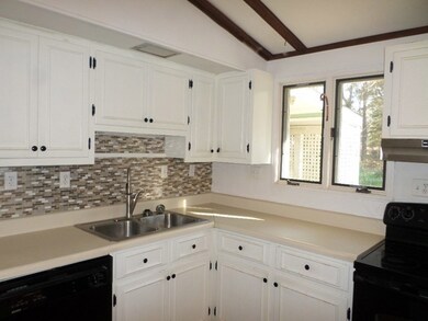 Lots of Cabinets In Kitchen With Walk-in Pantry
