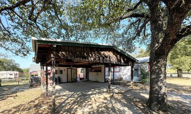 Carport with small detached storage area, with a s
