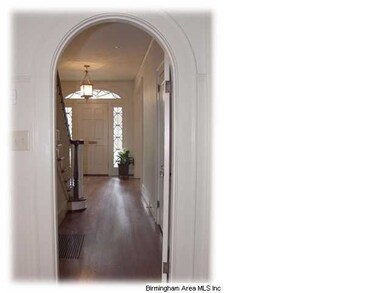 A View of the Front Door Through the Arched Doorwa