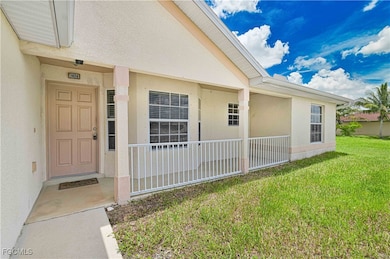 Doorway to property featuring stucco siding and a