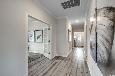 Hallway featuring light hardwood / wood-style floo