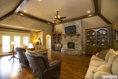 Living room with wood burning fire place, beams, w