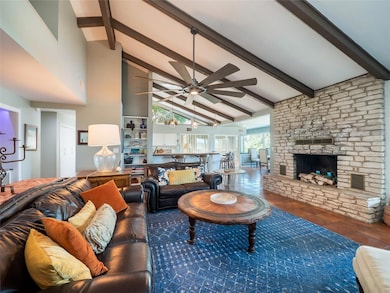 Tiled living room with beamed ceiling, high vault