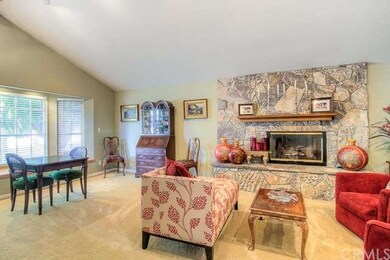 Sit near this stunning stone fireplace in your new