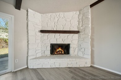 Corner wood-burning fireplace.