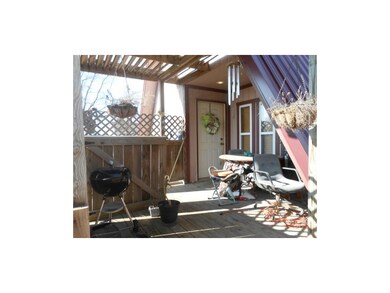 Entry thru covered porch/patio