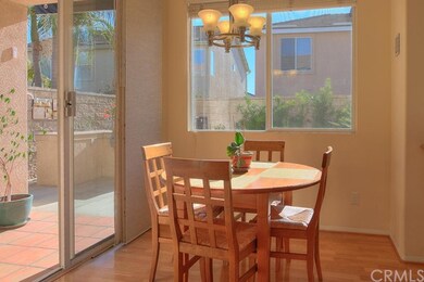 Cheery breakfast nook has sliders that open to bac