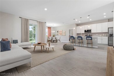 Living room with light hardwood / wood-style floor
