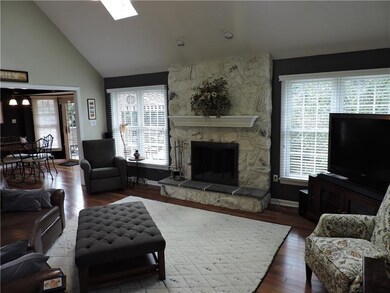 Two story family room comes with stone fireplace w
