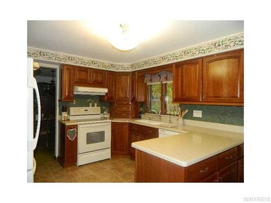 Kitchen Cherry cabinets and corian counter