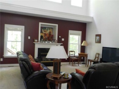 Dramatic Two Story Family Room with Gas Fireplace