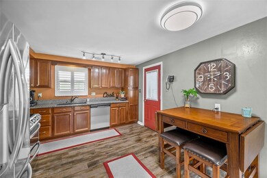 Large Kitchen with Cherry Cabinetry, Porcelain Til
