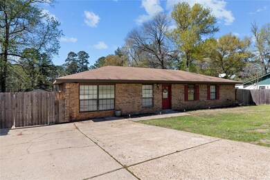 Single story home with a front lawn