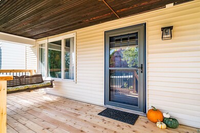 Doorway to property with covered porch