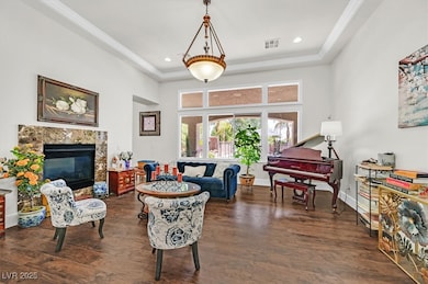 Living room with wood finished floors, ornamental