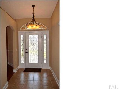 Beautiful Wrought Iron And Glass Door In The Foyer