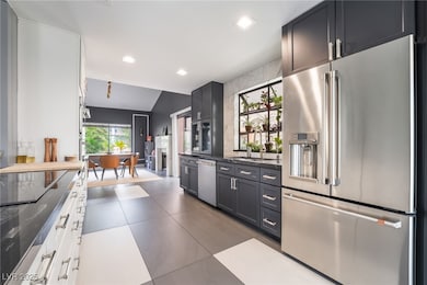 Kitchen featuring stainless steel appliances and d