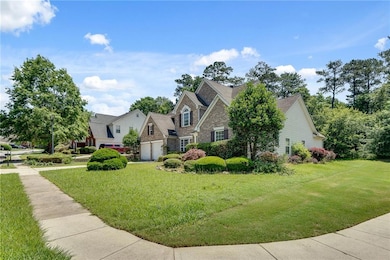 Traditional-style house featuring a front yard