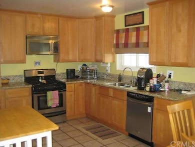 Remodeled kitchen with granite counter tops and st