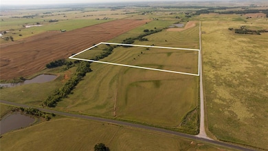 Drone / aerial view with a water view and a rural 