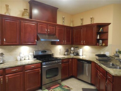 Deluxe kitchen with gas range and hood vented to o