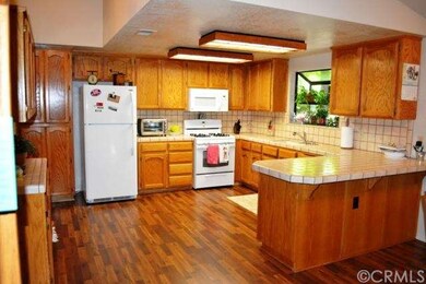 The open kitchen has new flooring, new paint and n