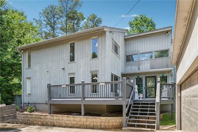 Back of property with a deck