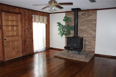 LIVING ROOM: Wood burning heater will help keep ho