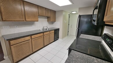 ANOTHER VIEW OF THE KITCHEN