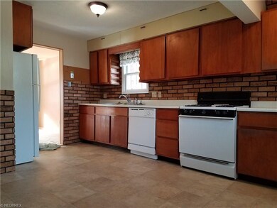Open kitchen design with new dishwasher and refrid