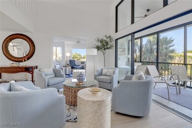 Living room featuring a high ceiling, plenty of na