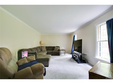 Living Room is in front of house off of Foyer