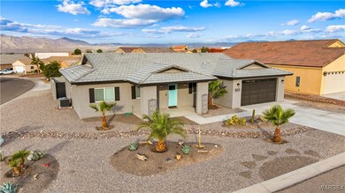 Ranch-style home with a mountain view, a garage, a