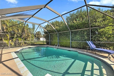 Outdoor pool with glass enclosure and a patio area