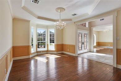 Truly spacious living room with wood flooring, tra