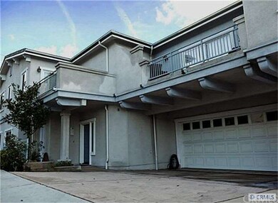 Street view on 20th St, balcony above garage.
