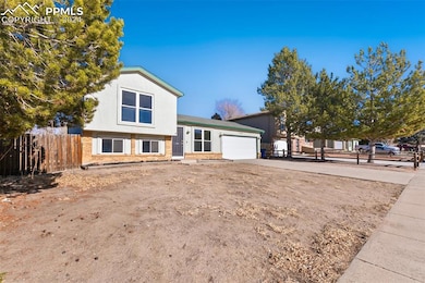 Split level home featuring a garage