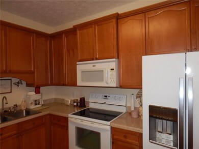 PRETTY STAINED CABINETS-ELEC STOVE