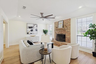 Front living area with light wood-type flooring, a